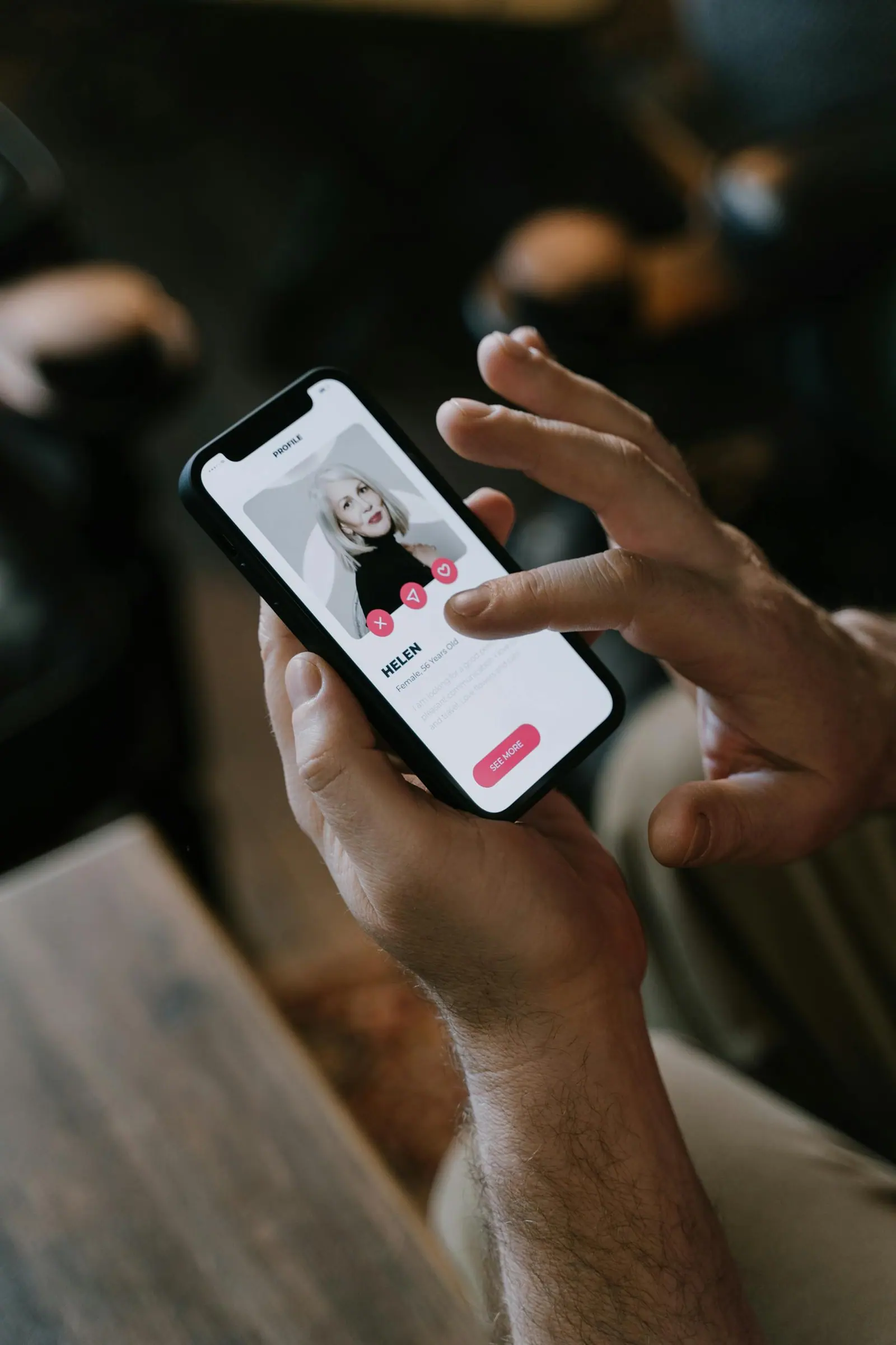 Close up of hands using a dating app on a smartphone indoors modern technology and online dating